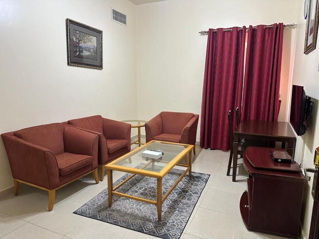 Living room of a one-bedroom apartment at Al Reem Hotel Apartments